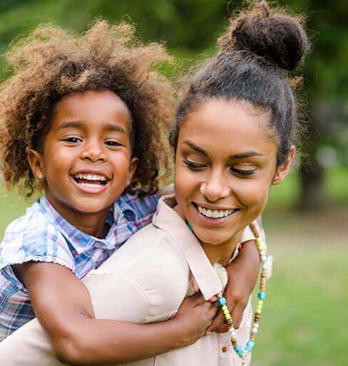 happy mom and young daughter