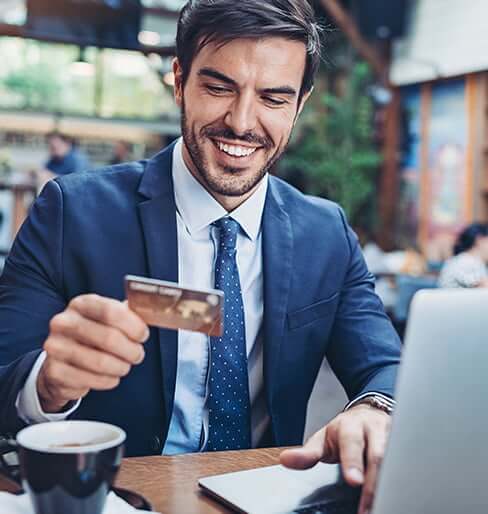 smiling man paying bill