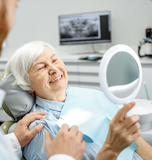 woman smiling in mirror